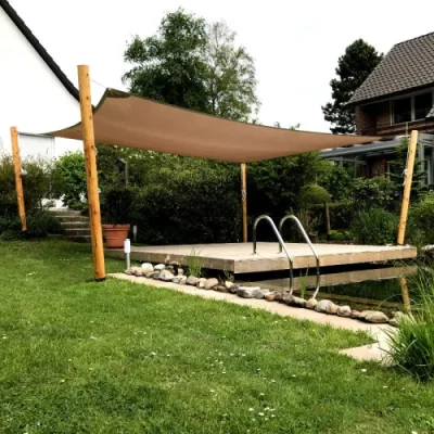 Sicheres Sonnensegel über Spielbereich im Garten